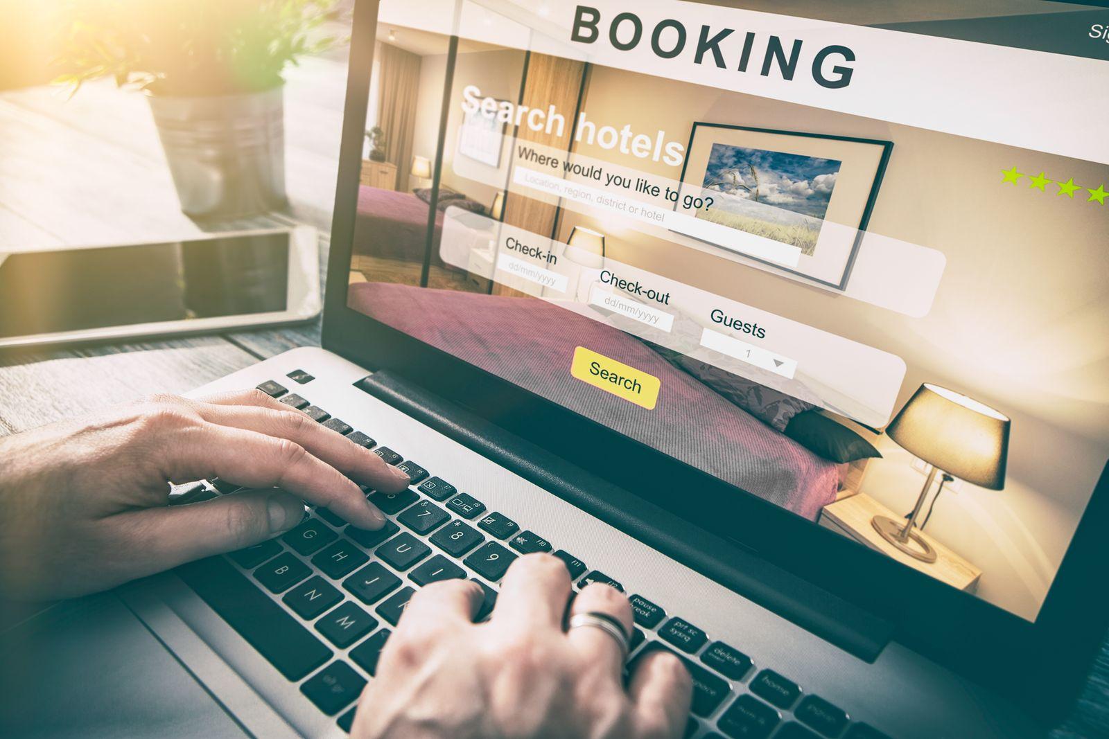 Someone searching a hotel booking website on a laptop