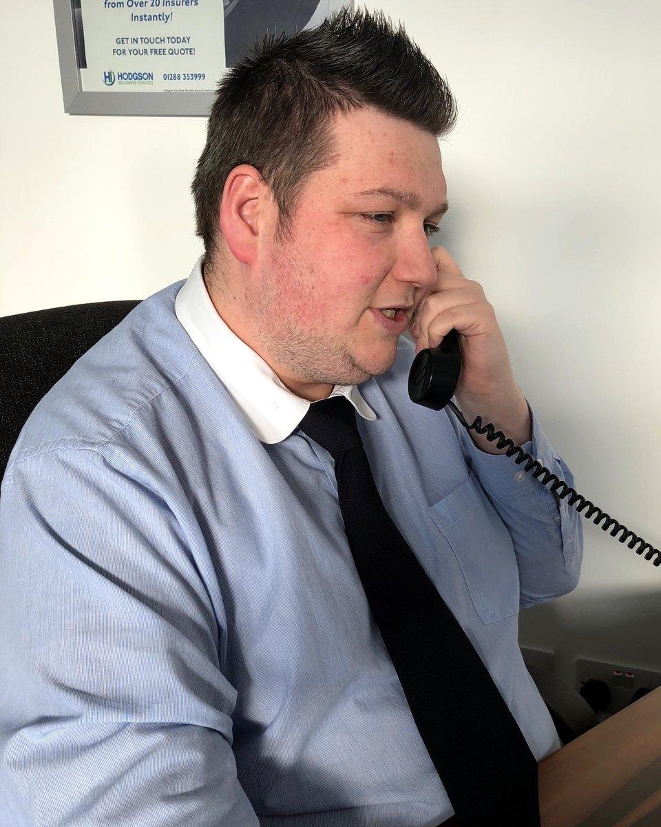 Aaron Nash on the phone at his desk