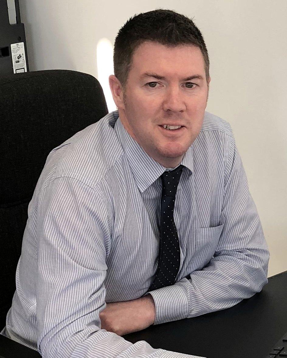 Gary Hodgson at his desk